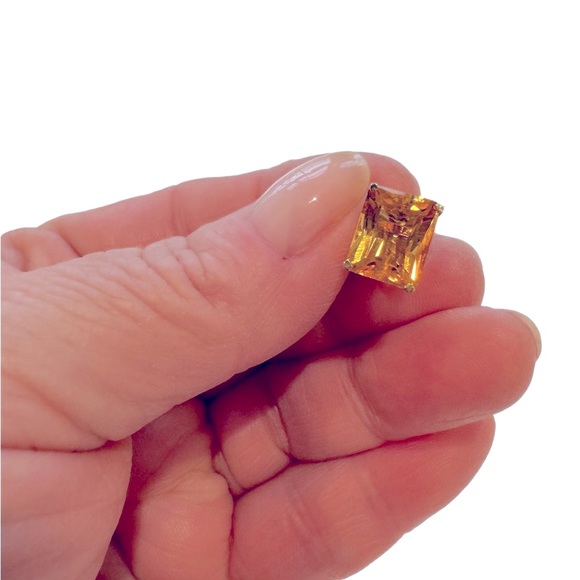 Emerald cut citrine stud earrings set in 14 karat gold. NWT